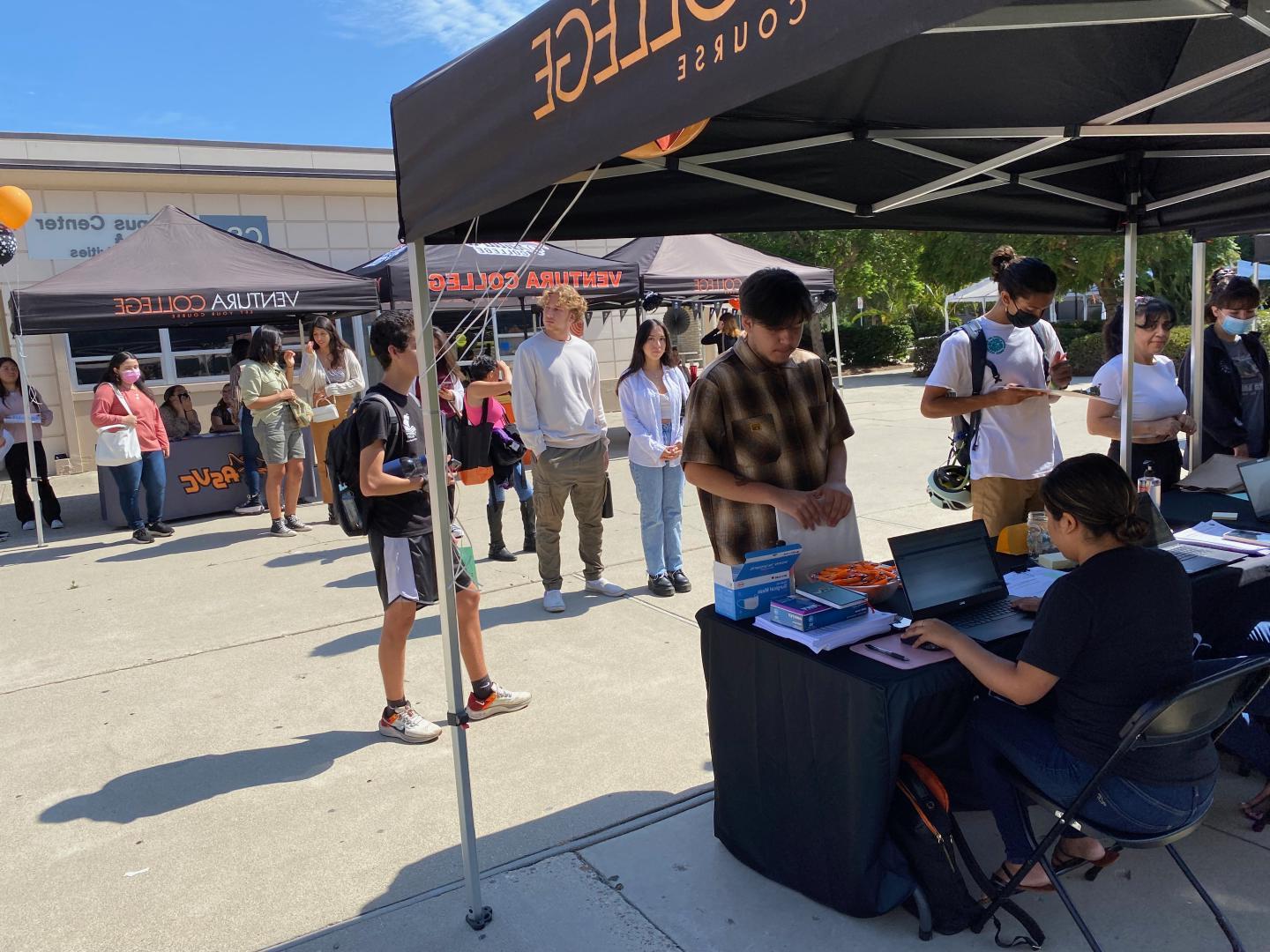 Tables and balloons set up with students visiting the FWS Job Fair